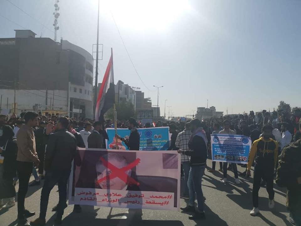 Demonstrators block roads in Iraqi cities to protest against the assignment of Allawi