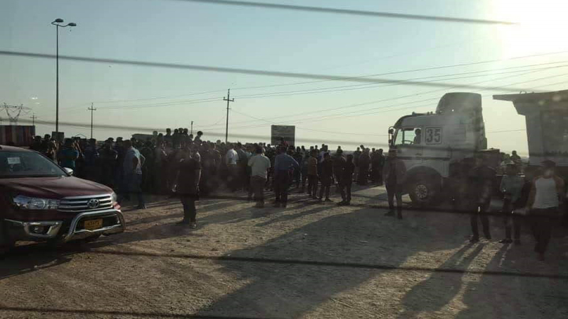 Protesters block a border crossing with Iran