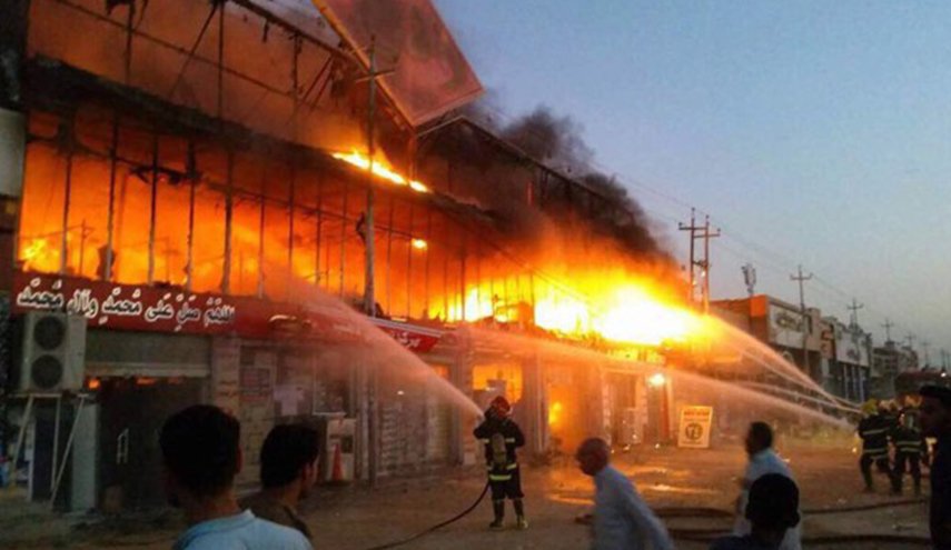 Commercial stores damaged in an IED attack in Diyala 