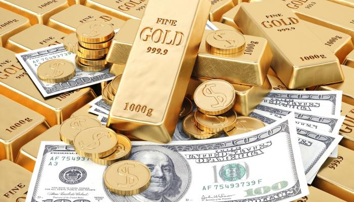Gold eases as dollar rises