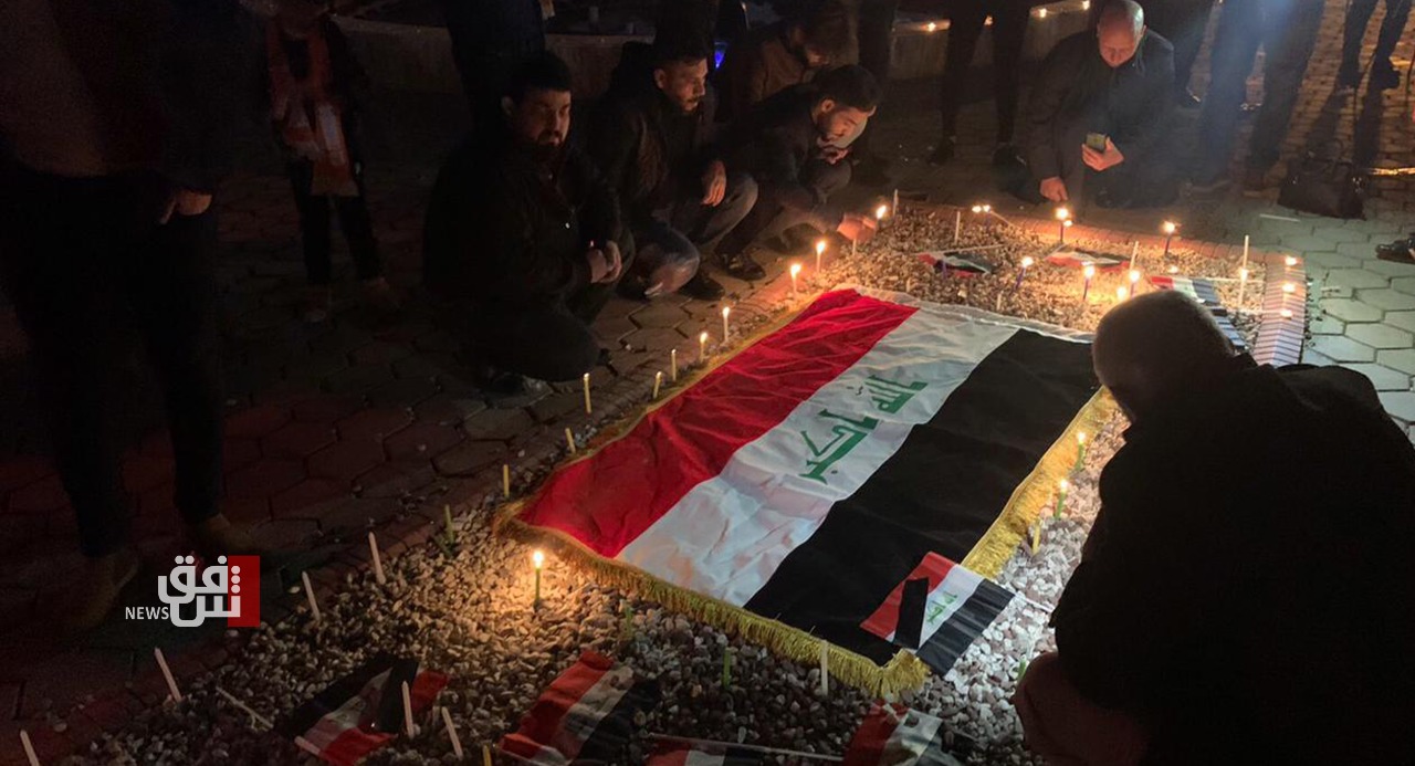 Kirkuk activists light candles honoring the victims of Baghdad explosions 