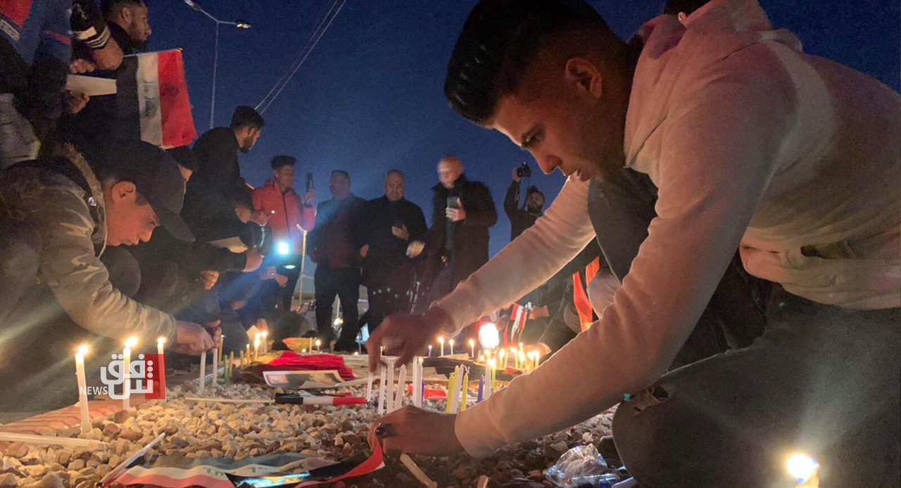 Kirkuk activists light candles honoring the victims of Baghdad explosions 