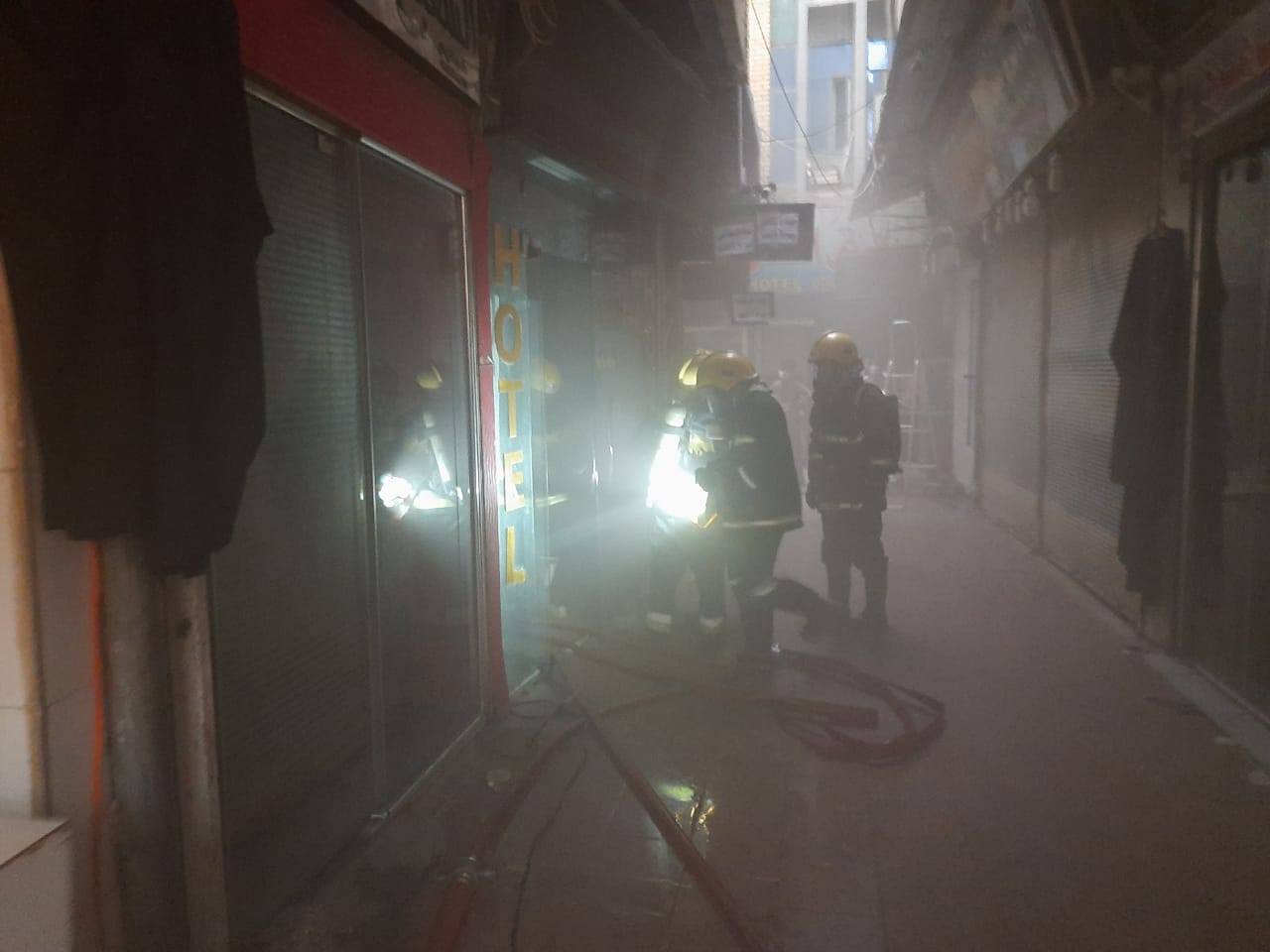 Firefighters extinguish a fire in a hotel in Najaf