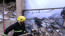 The Civil Defense teams extinguish a fire that broke out in Samarra Tax Department