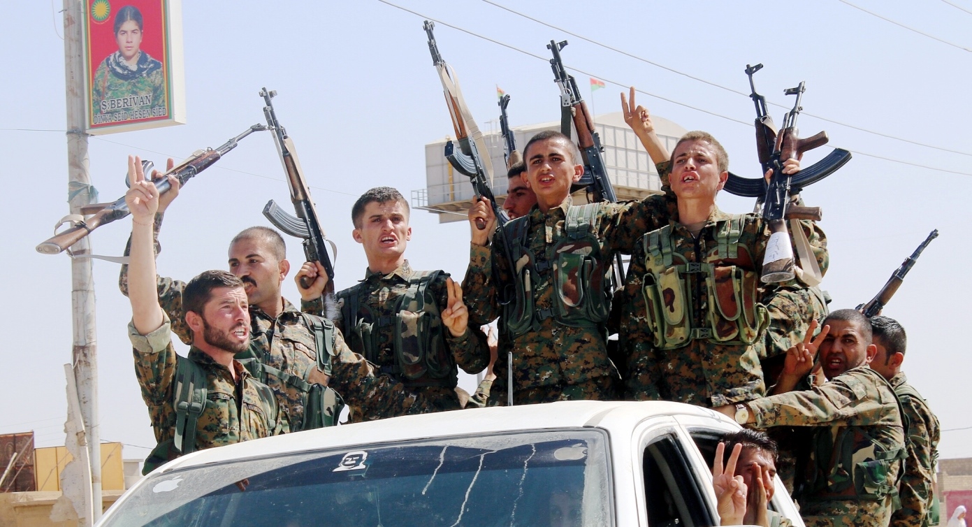 Kurdish fighters storm an Iraqi intelligence headquarters and arrest an officer