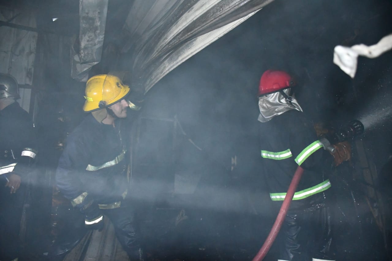 Civil Defense teams extinguish the fire that broke out in a Baghdad market 