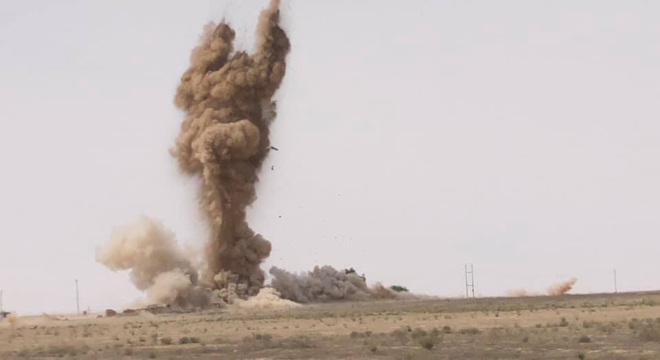 An explosion from a roadside bomb hits a coalition convoy in Saladin