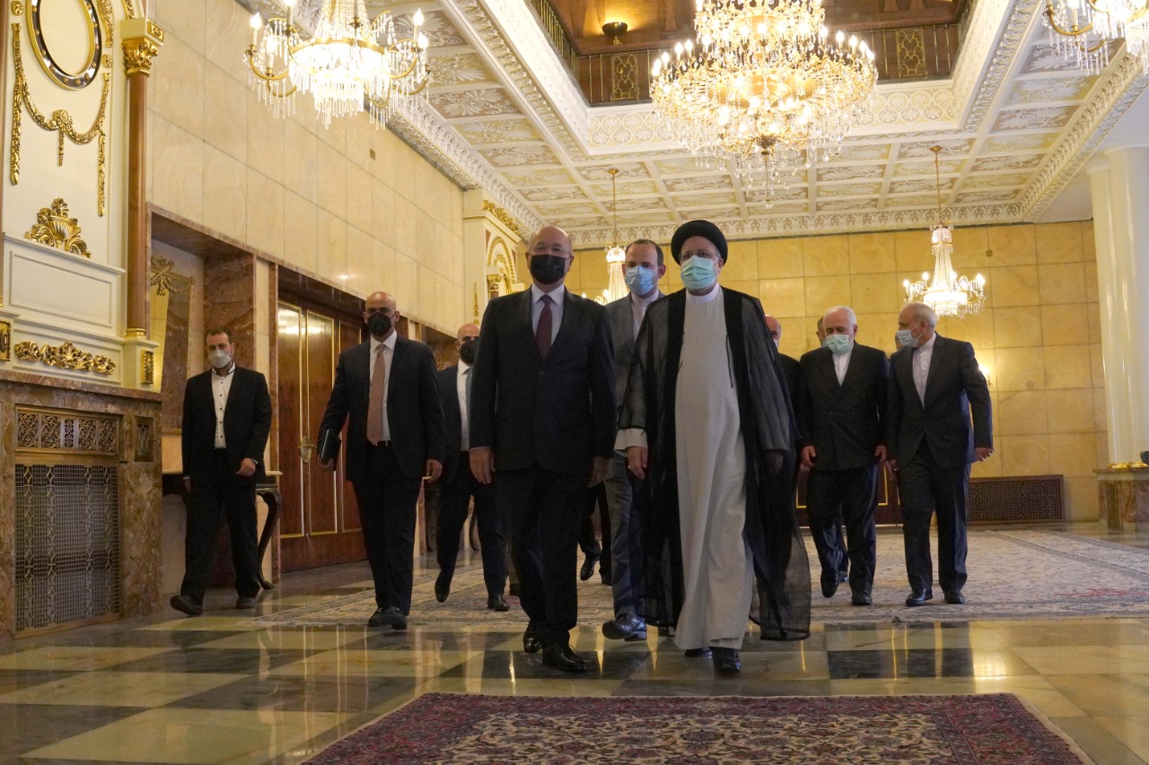 Iraqs President holds first meeting with the new Iranian President Ibrahim Raisi in Tehran