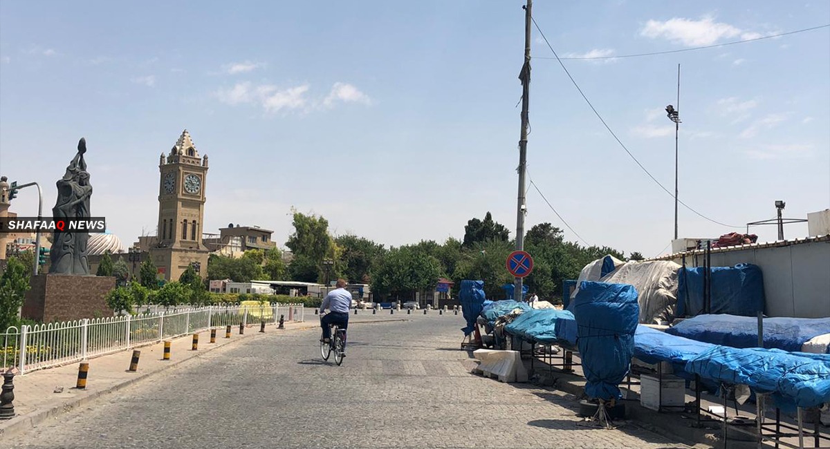 Protesting water outage demonstrations block a main road in Erbil