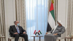 Allawi hands over an invitation to Abu Dhabi's crown prince to attend the Baghdad summit