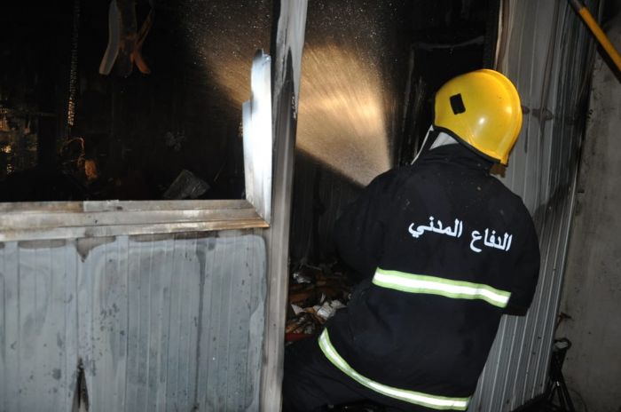 Civil defense teams extinguish a fire south of Baghdad 