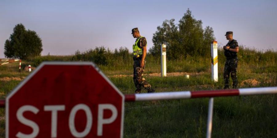 About 60 migrants stuck on Belarus' borders with Poland, Latvia