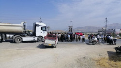 Angry demonstrators block a vital road in Kalar 