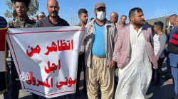 Demonstrators block a vital street in Diyala protesting the election results