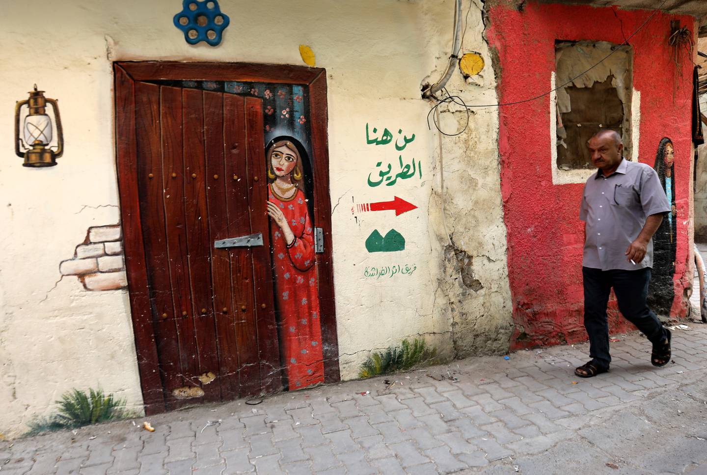 "أثر الفراشة" رسومات جدارية من أجل بث الأمل والسعادة في حي الانباريين ببغداد