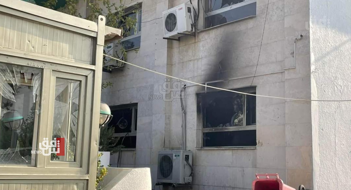 Students storm into a PUK headquarters in al-Sulaymaniyah, burning part of the building down