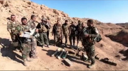 Peshmerga clear a booby-trapped road in Qara tappa