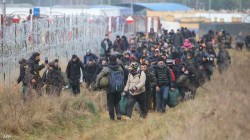 العراق يعيد "طوعاً" 110 مهاجرين عالقين على الحدود البولندية 