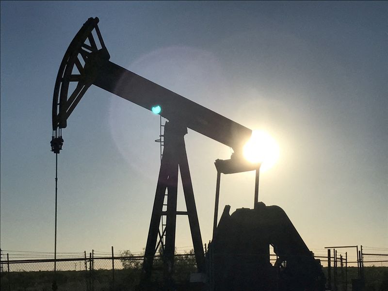 Oil dips from seven-year high as Russia tensions offset Fed tightening