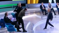Ukrainian journalist punches MP and gets him in headlock during TV panel show