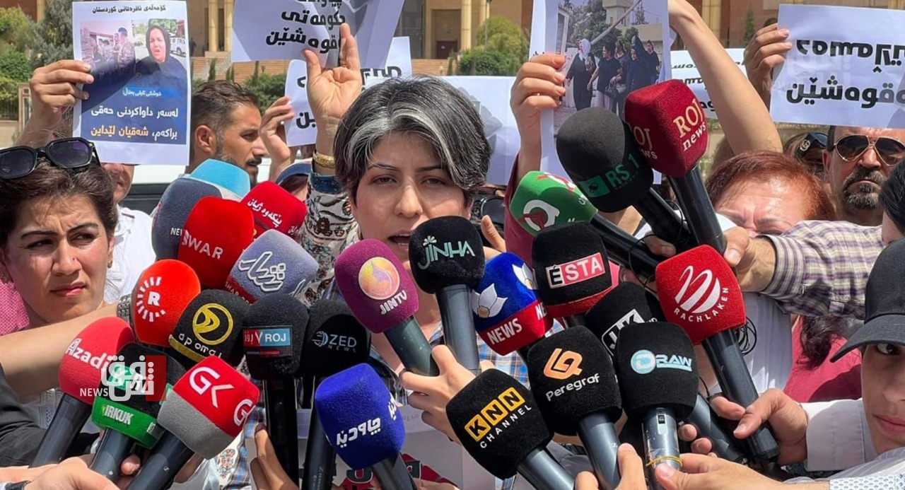 Activists gather near alSulaymaniyah Court to protest violence against women 