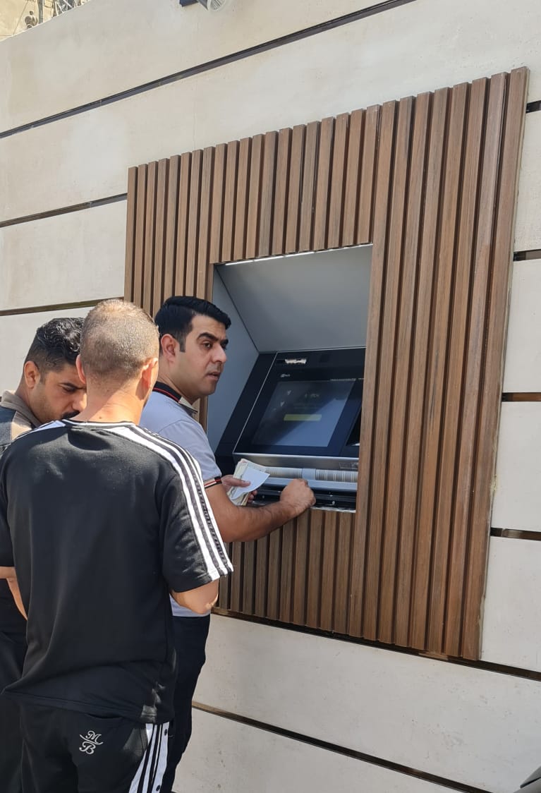 To facilitate the receipt of salaries.. Al-Rasheed Bank is setting up automatic teller machines that operate throughout the day