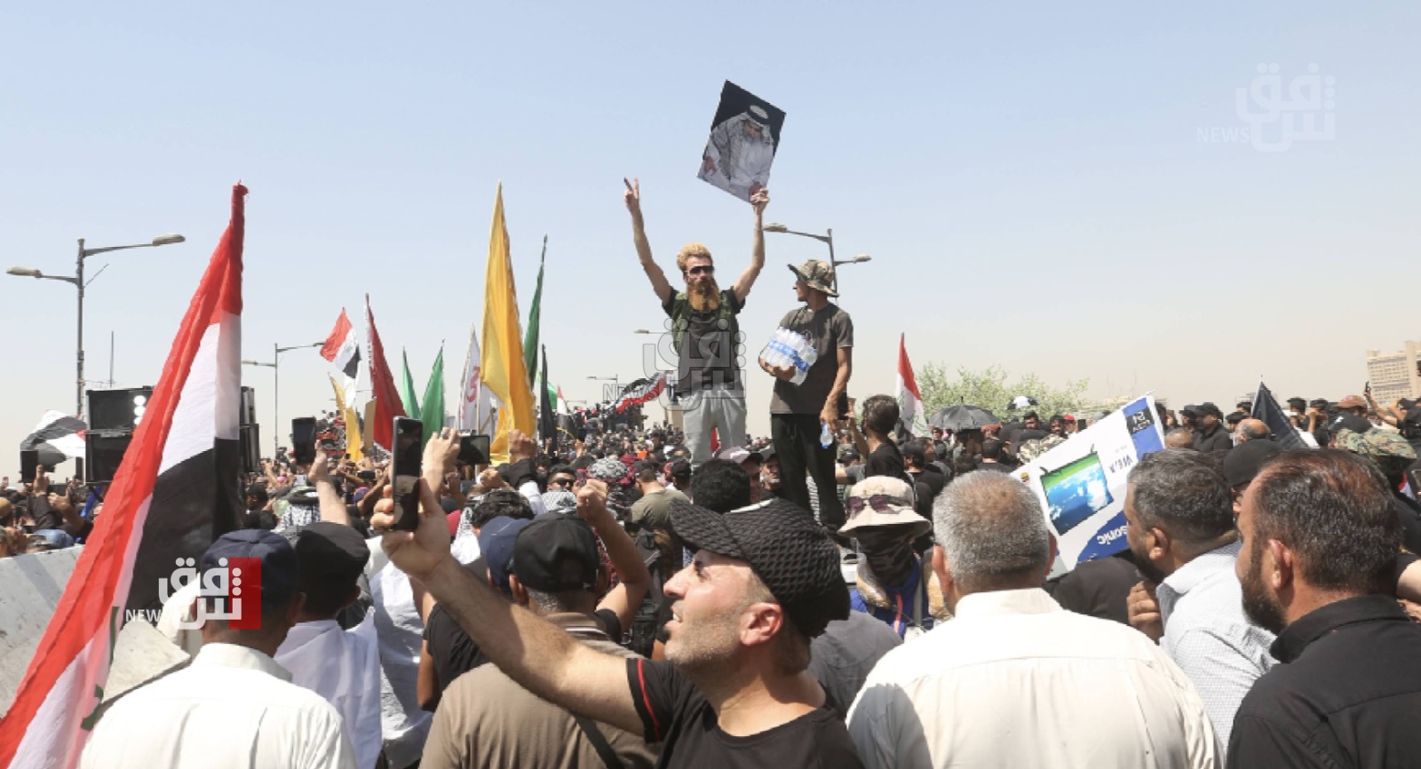 Protestors swarm into the Iraqi parliament building in Baghdad