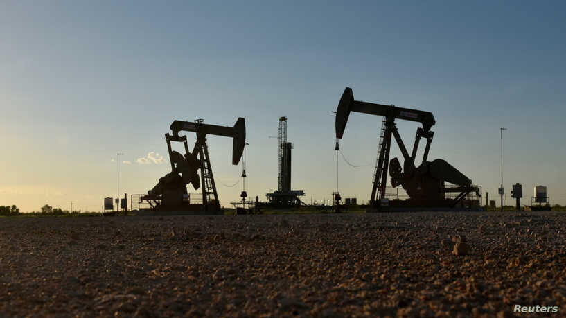 Oil prices edge up from 6-month lows after drop in U.S. stockpiles