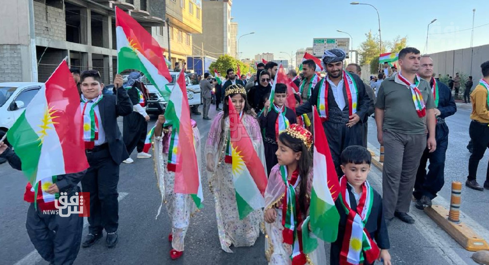 People march in Erbil to commemorate the independence referendum