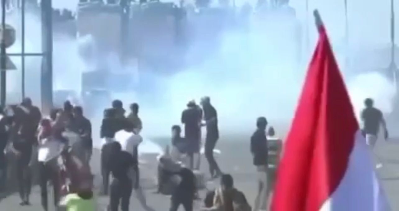 Injuries among protesters and law enforcement in clashes on a bridge leading to the Green Zone