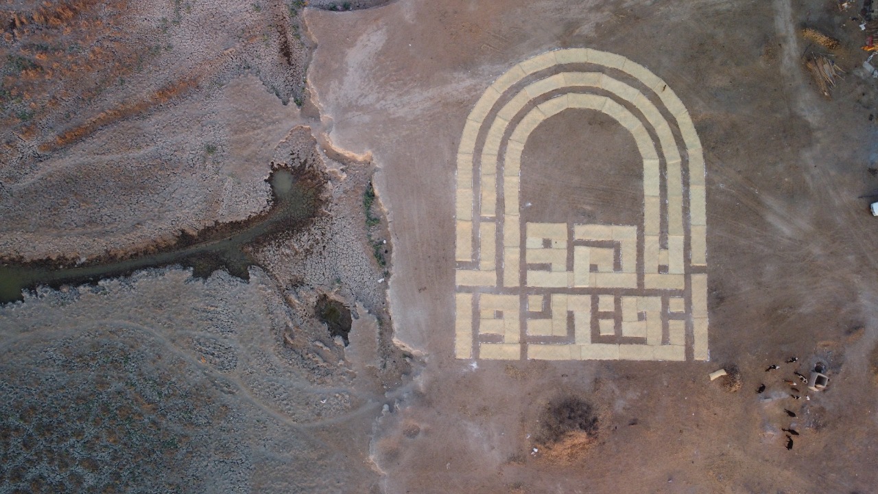 "Save the Marches": Iraqi artist raises awareness with huge calligraphy earthwork 