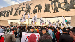 Demonstrators gather in Baghdad's al-Tahrir to protest the dinar's depreciation
