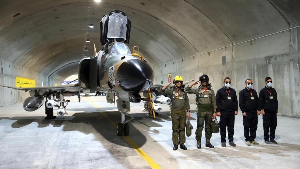 Iran unveils underground airbase with jets armed with long-range missiles