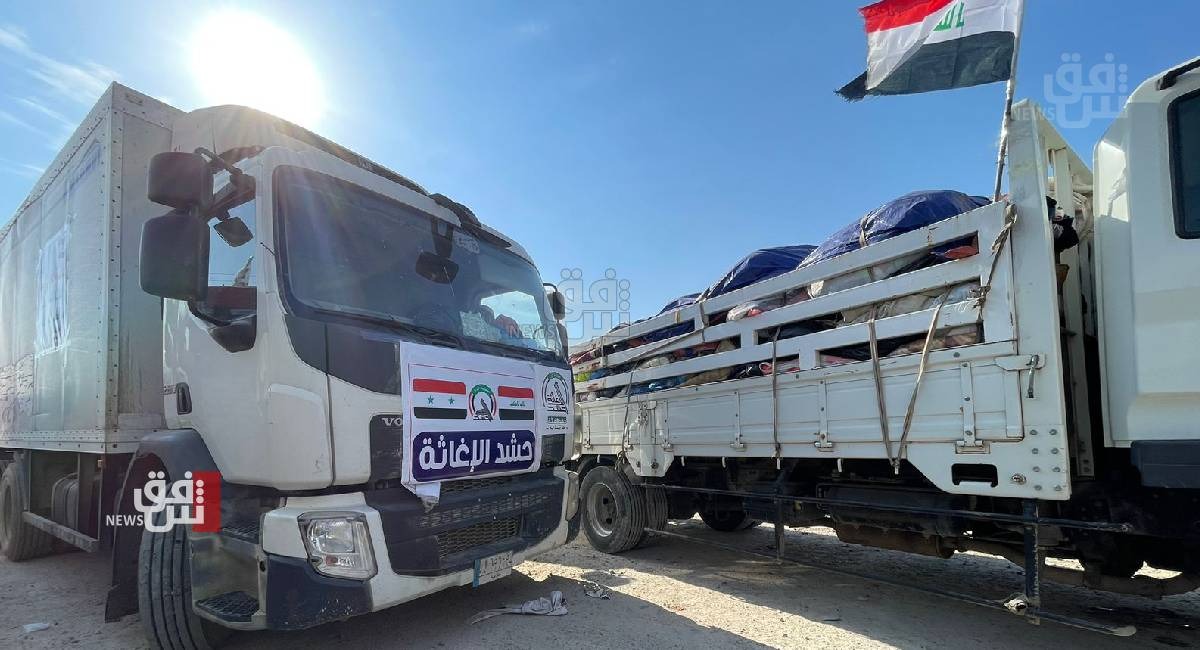 Vehicles carrying humanitarian aid enter Syria through Al Bukamal