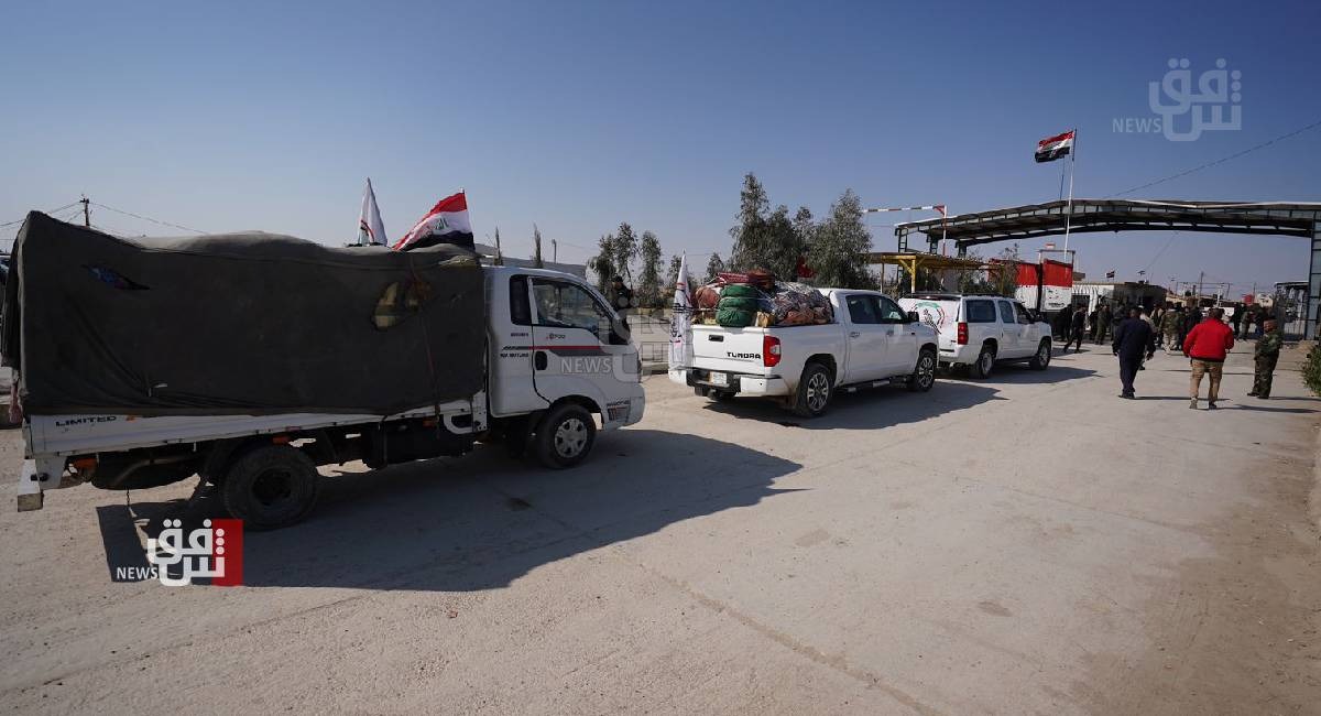 Vehicles carrying humanitarian aid enter Syria through Al Bukamal