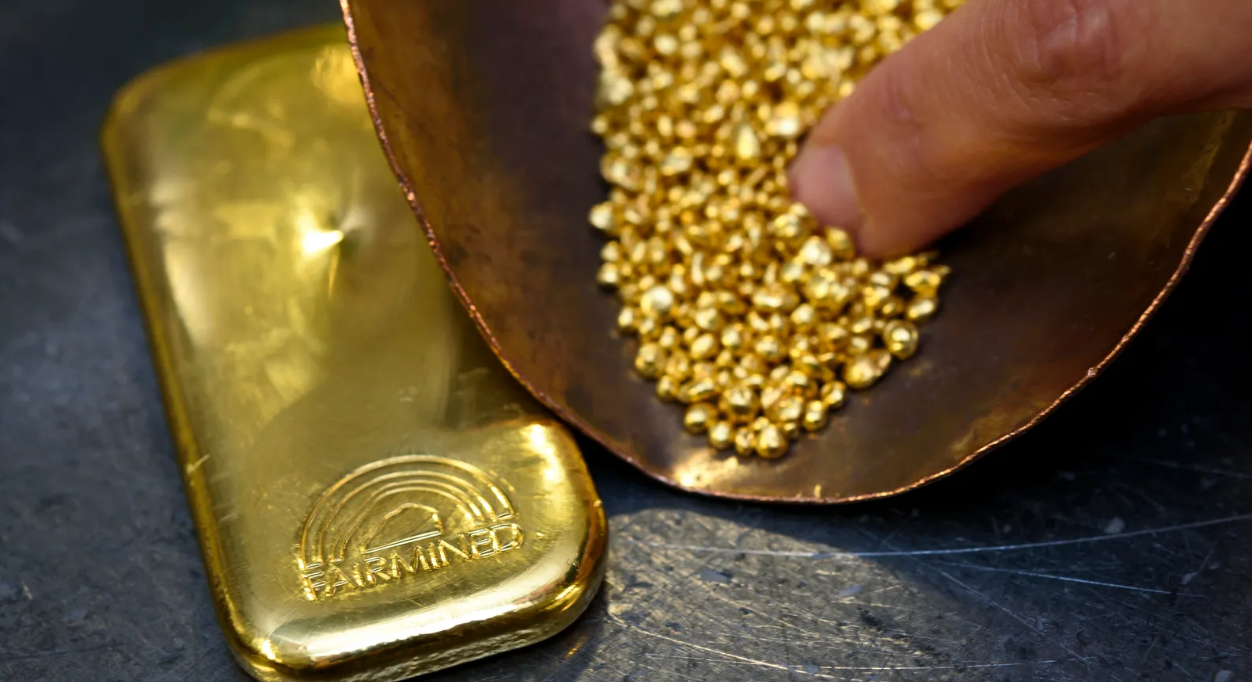 Gold at over one-year peak as weak US data buoys demand