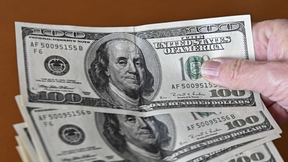 Dollar steady as traders weigh higher-for-longer US, global rates