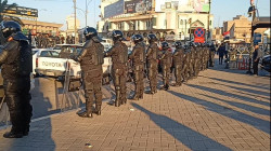 اشتباك بالايدي بين الحشد وقوة أمنية وسط بغداد