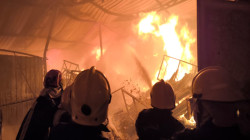 إنقاذ عاملين أجنبيين بإخماد حريق كبير في بابل (صور)