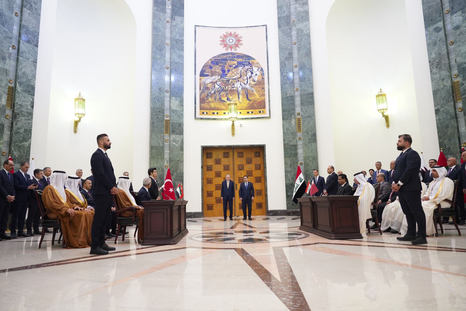 Sudanese and Erdogan sponsor the signing of a four-way memorandum of understanding between Iraq - Turkey - Qatar and the UAE