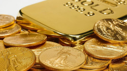 Gold slips from record levels as dollar holds ground