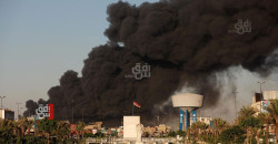 Iraqi firefighters contain blaze on Baghdad's Al-Dhilal Street after smoke plumes engulfed the city center