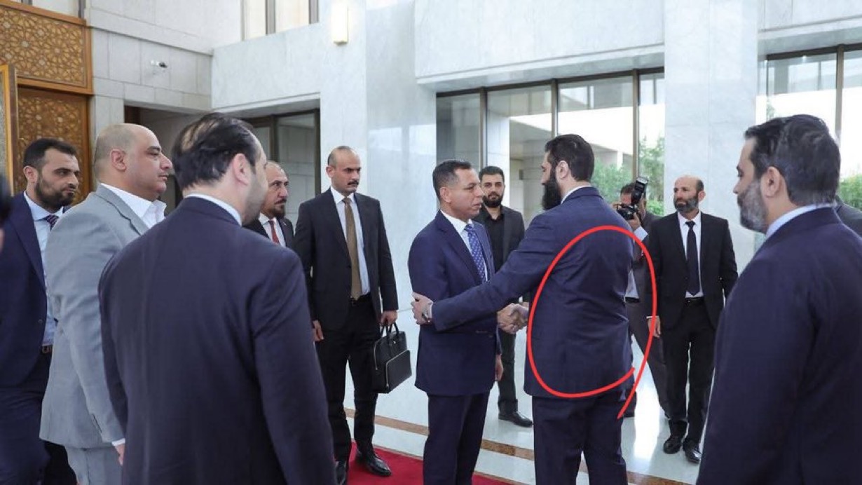 Handgun visible under suit jacket: Syria's new leader sparks stir during Iraqi delegation visit