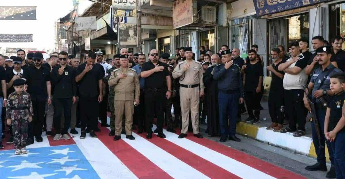 وزير الداخلية العراقي يعاقب ضباطاً شاركوا في فعالية تضمنت "دعس" العلم الأمريكي