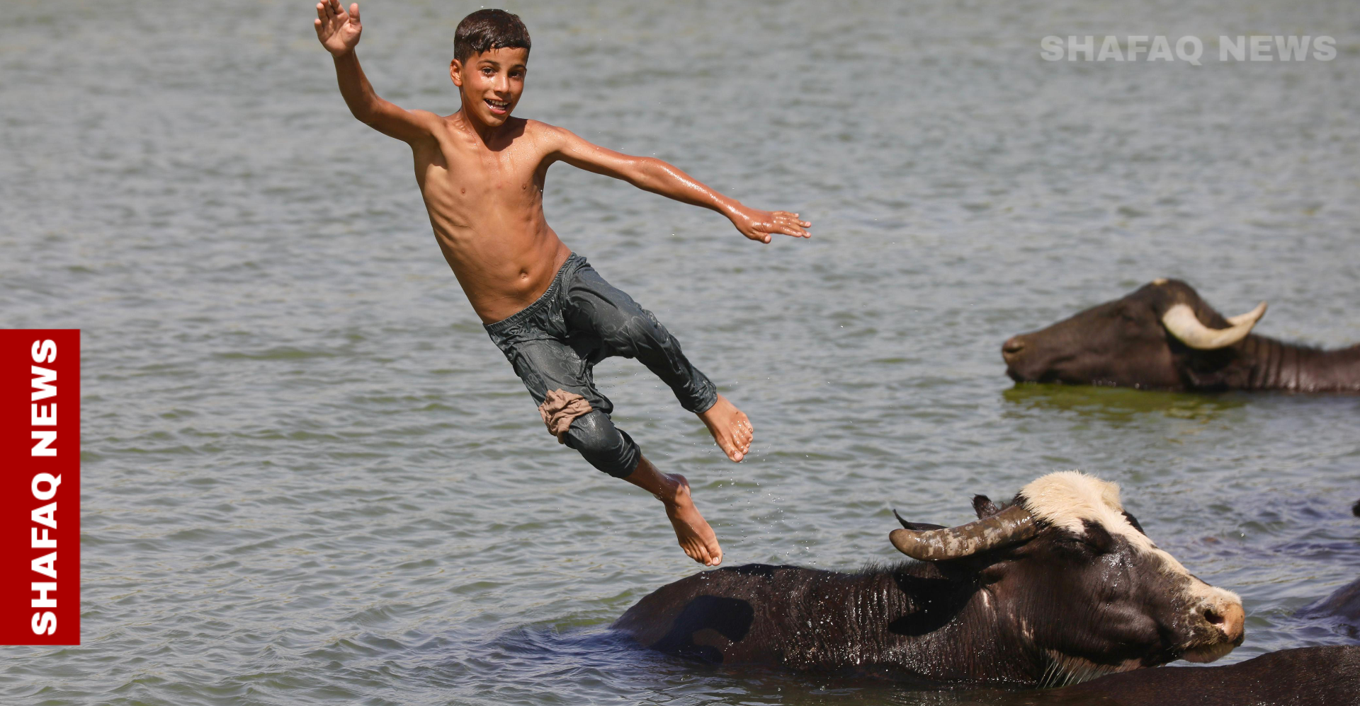 Scorching summer drives Iraqis to rivers