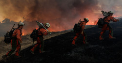 Massive wildfires ravage Western US