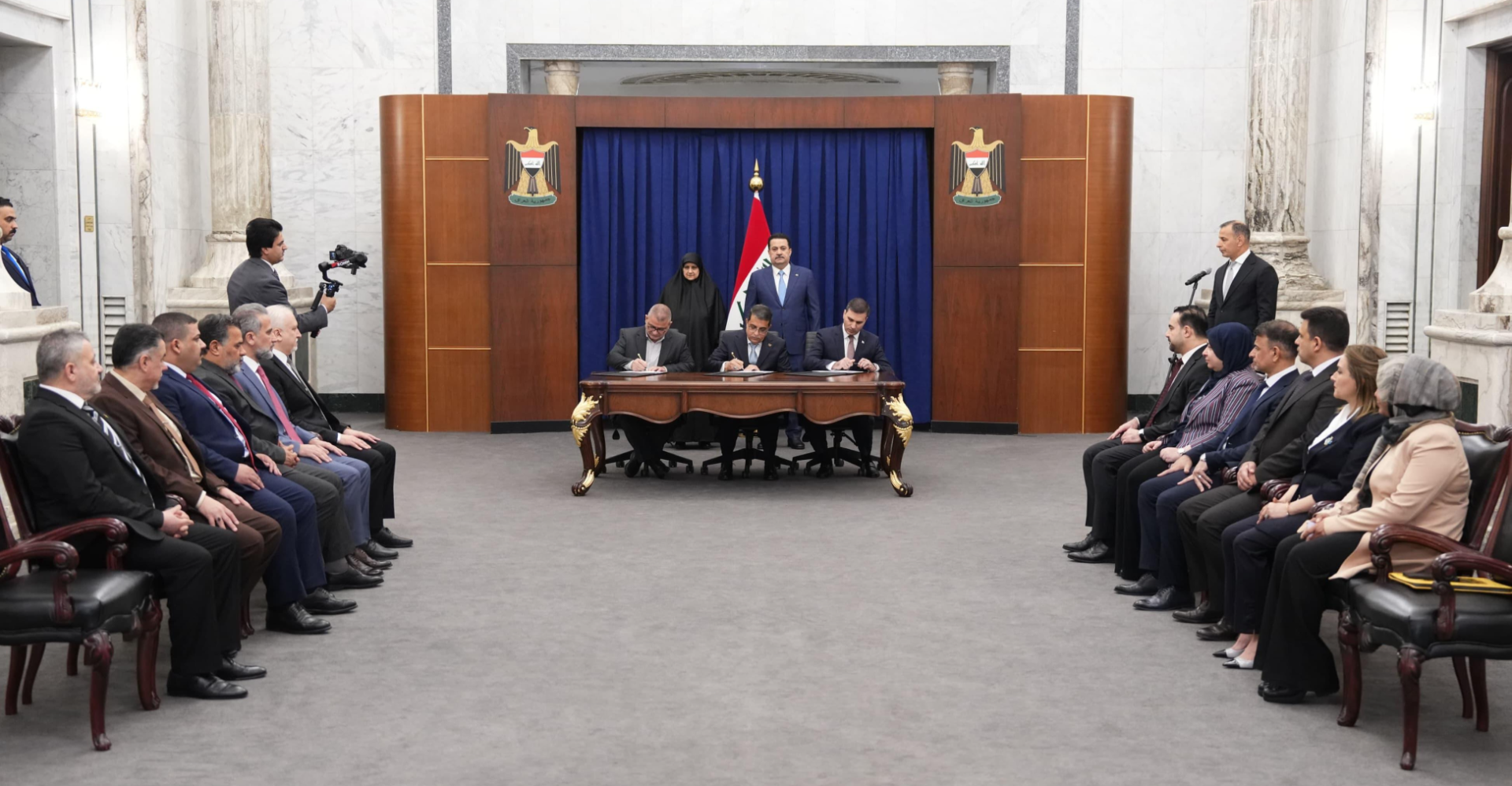 Signing the contract to establish the National Mobile Telephone Company in Iraq