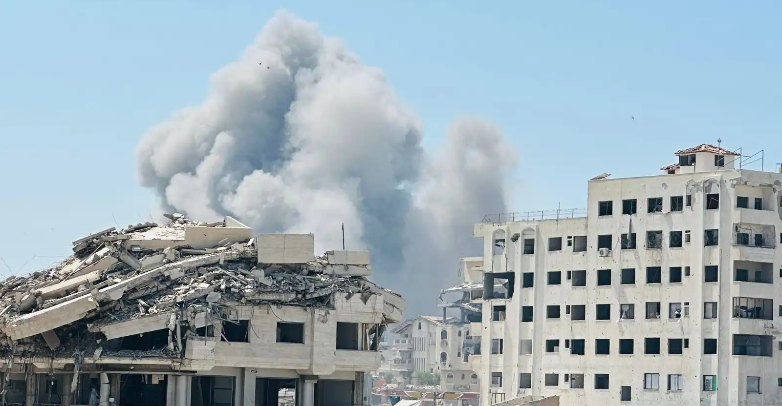 Israeli airstrikes flatten tower in crowded Gaza district