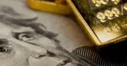 Gold slips as stronger dollar, Fed uncertainty weigh on prices