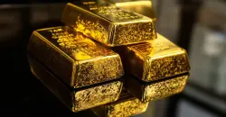 Gold hits two-week high, set for fourth monthly gain